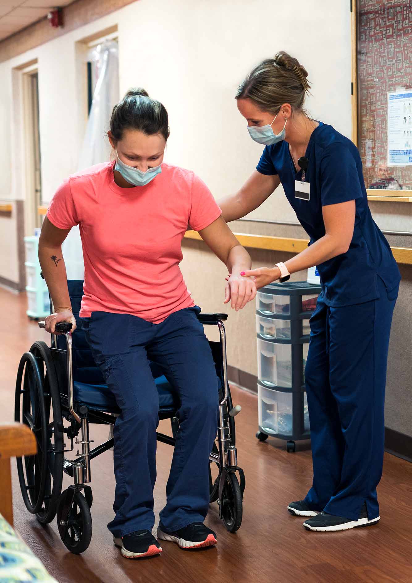patient in wheelchair with nurse