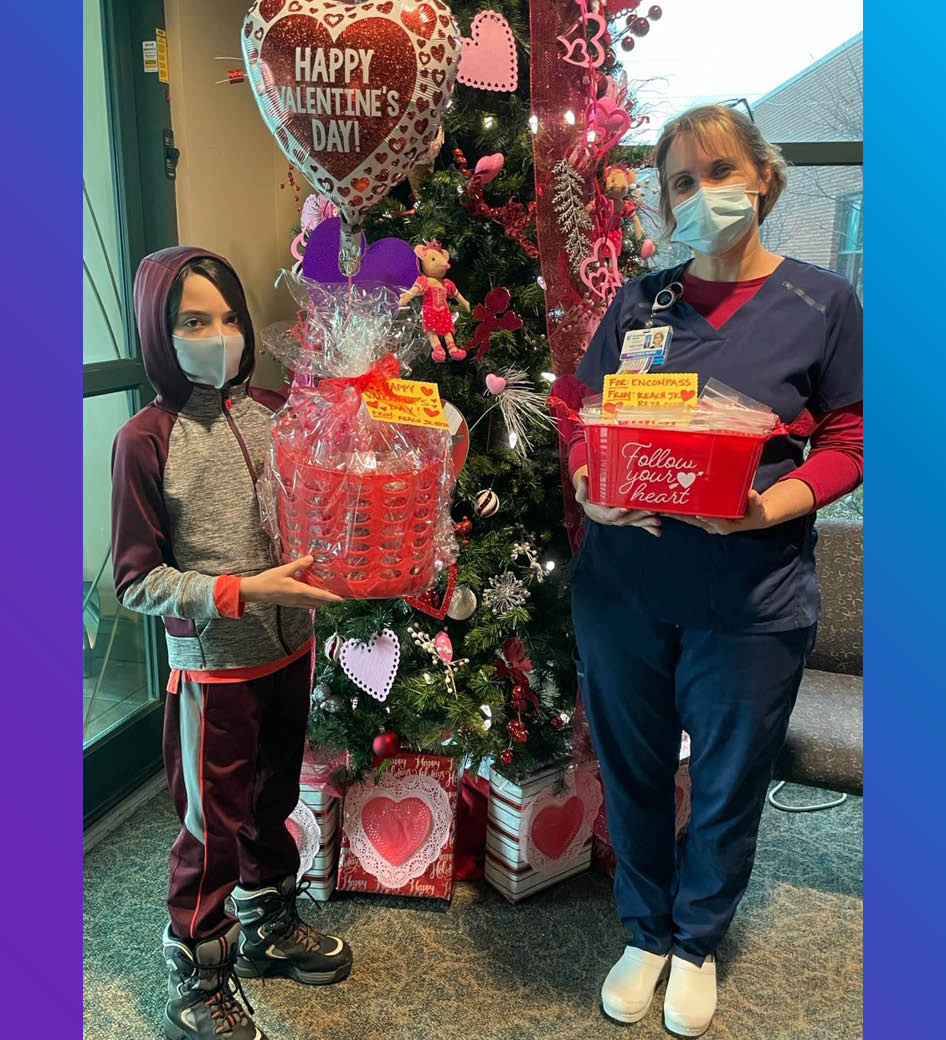 Fredericksburg REACH Junior Beta Club member Weston Roman and his mother, Yvette, presented Heather Hirons, RN, with goodie bags on Valentine