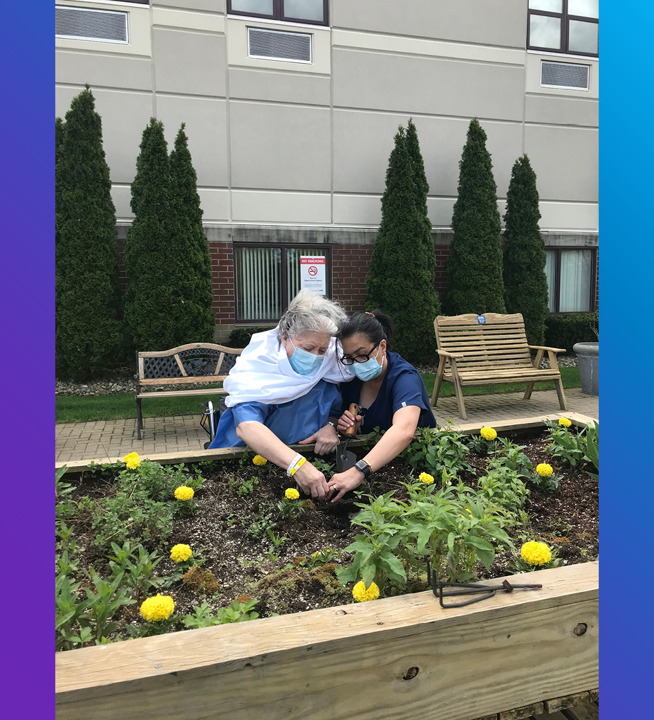 Supporting Parkinson’s Awareness Month, Maribel Novera, occupational therapist, and Joan Bozza, patient, enjoy some afternoon therapy by planting tulips in our outdoor courtyard.